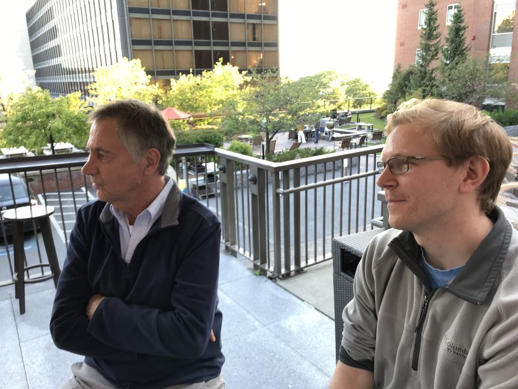 Photo of educational leader and educator discussing school change