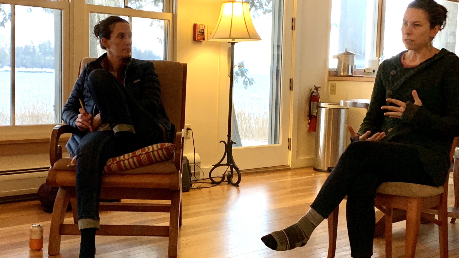 Photo: Gretchen listens during The Dark Side retreat as an educator shares about the struggles in educational leadership