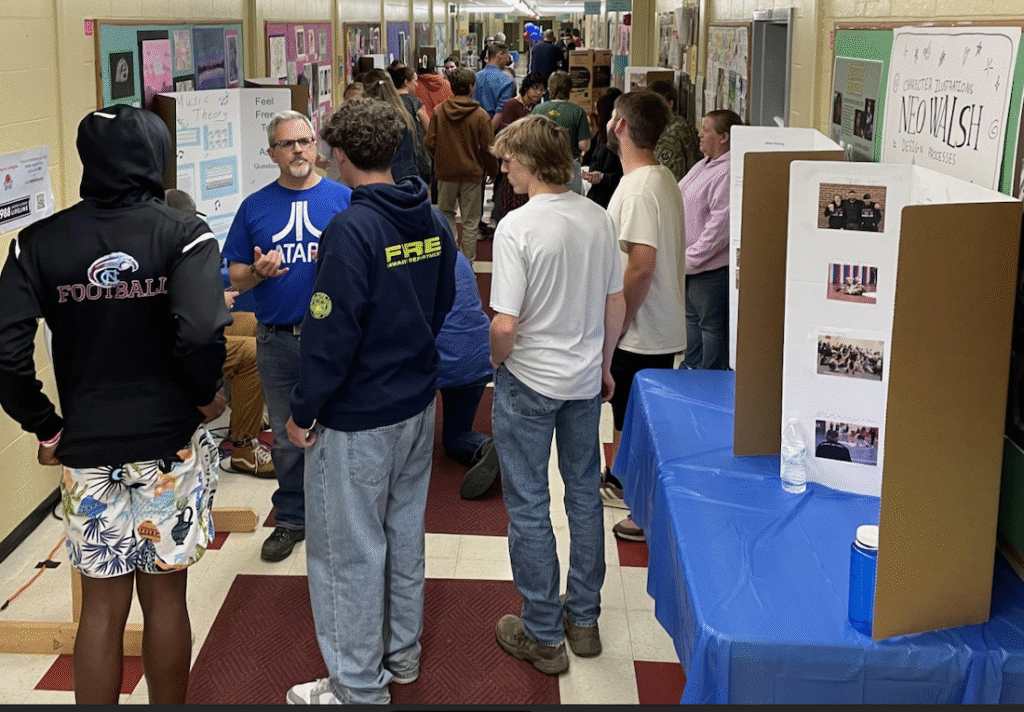 Image of hall filled with students and parents